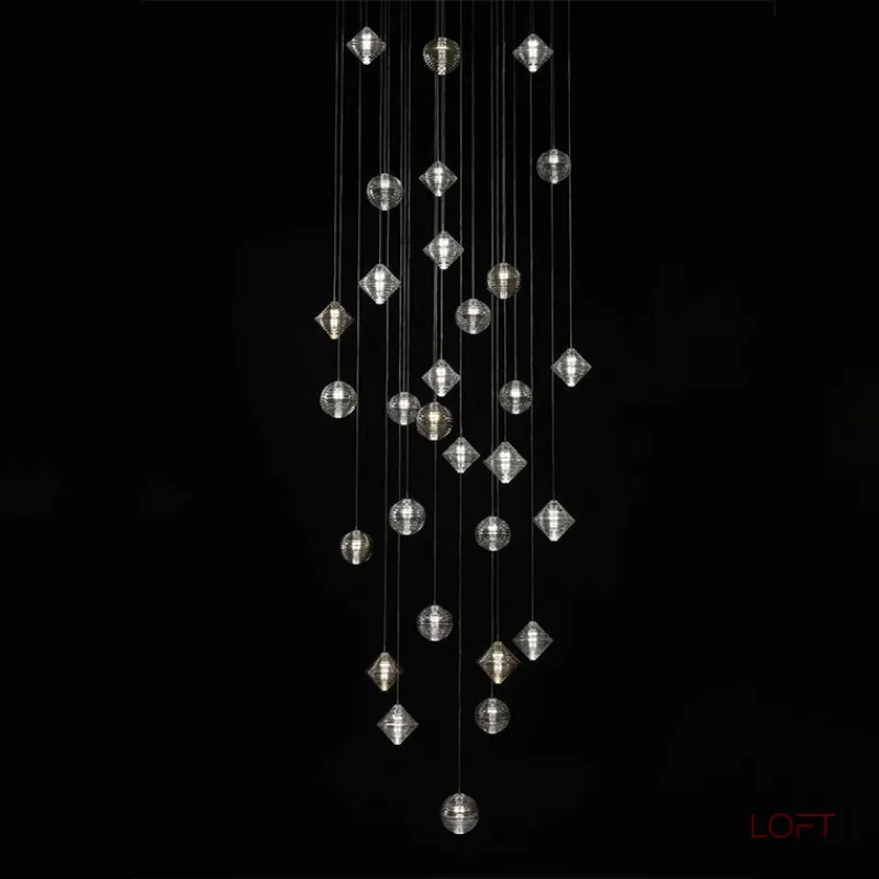 Каскадный светильник с комбинацией из 30-ти стеклянных подвесов в форме призм и сфер с концентрическим рельефом STYRK COMBO от ImperiumLoft