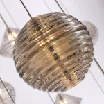 Каскадный светильник с комбинацией из 30-ти стеклянных подвесов в форме призм и сфер с концентрическим рельефом STYRK COMBO от ImperiumLoft