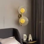 Настенный cветильник с кремово-желтыми шарообразными плафонами внутри стеклянных купольных рассеивателей разной фактуры ROMANUS WALL S от ImperiumLoft