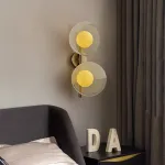 Настенный cветильник с кремово-желтыми шарообразными плафонами внутри стеклянных купольных рассеивателей разной фактуры ROMANUS WALL M от ImperiumLoft