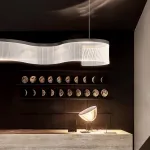 Серия реечных светильников с линейной гравировкой на прозрачном изогнутом корпусе со светодиодной подсветкой DANELIUS LONG L150 от ImperiumLoft