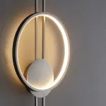 Настенный светодиодный светильник в виде комбинации светящегося кольца и двух стержней на круглом креплении ACTION Black от ImperiumLoft